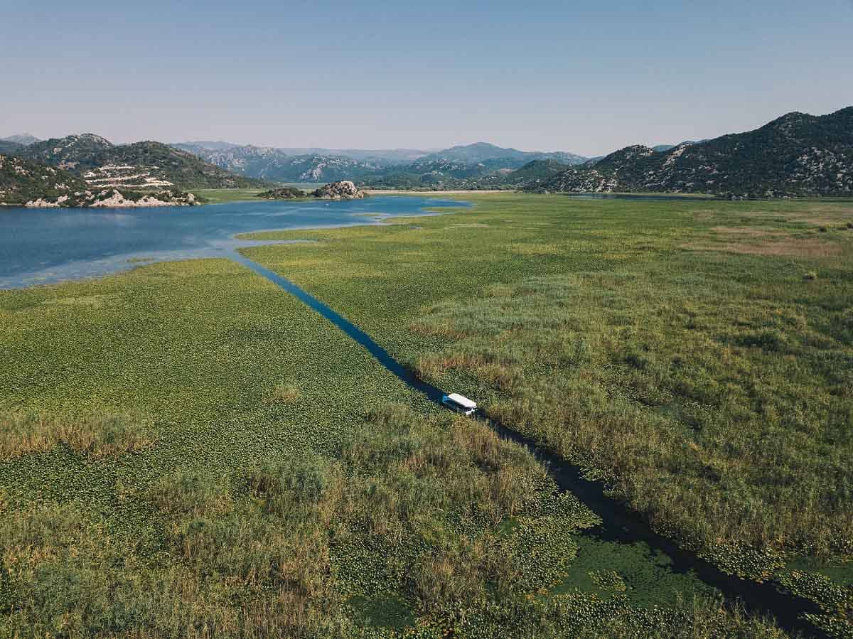The panorama of traditional boat in Skadar Lake, during the private cruise tour.